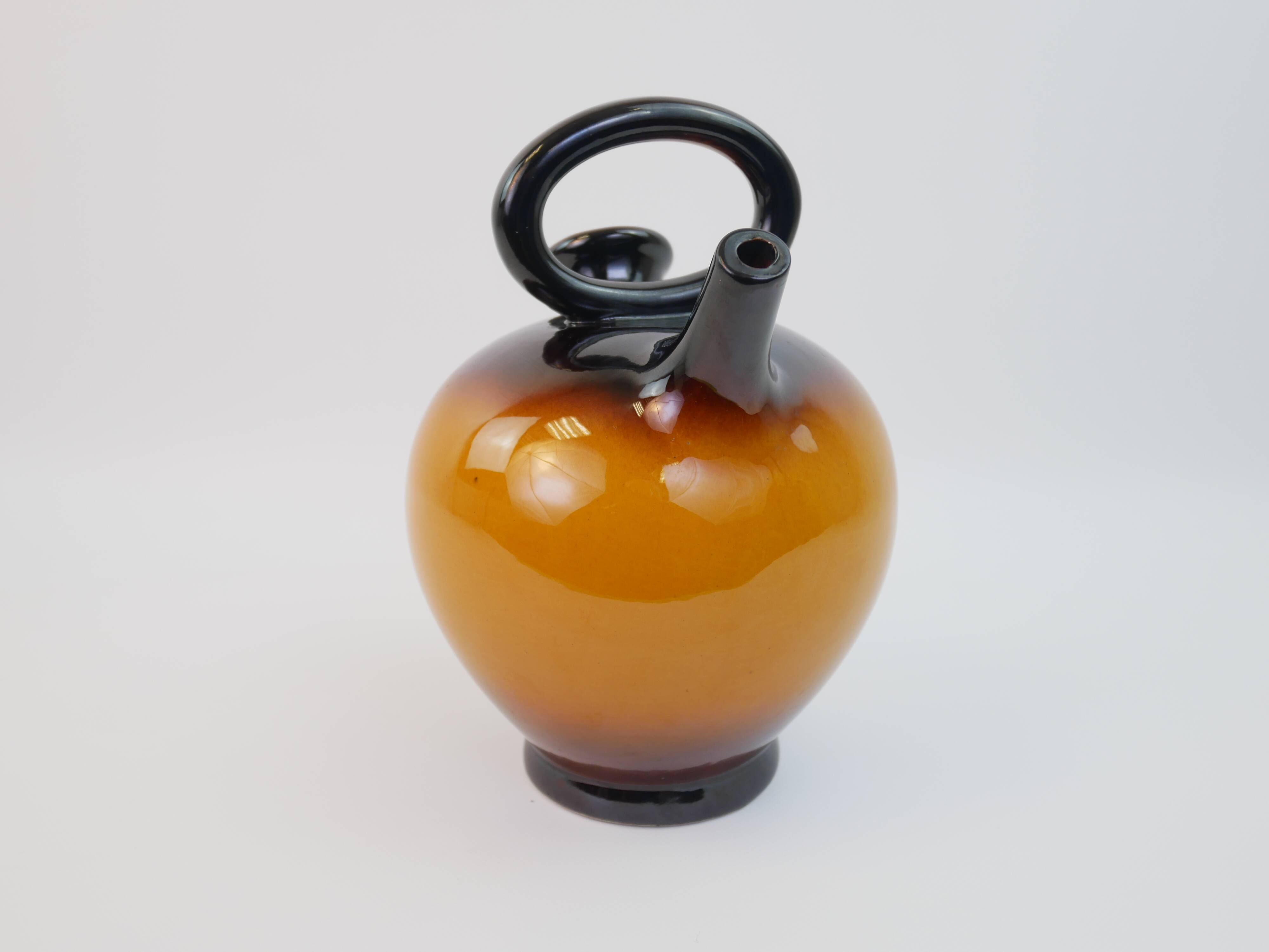 Ochre-orange ceramic jug signed under the base CP Claude Paci