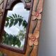Petit miroir en bois ancien sculpté de fleurs 36x25