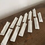 Vintage knife holders of 12, in white wave-shaped porcelain