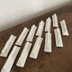 Vintage knife holders of 12, in white wave-shaped porcelain