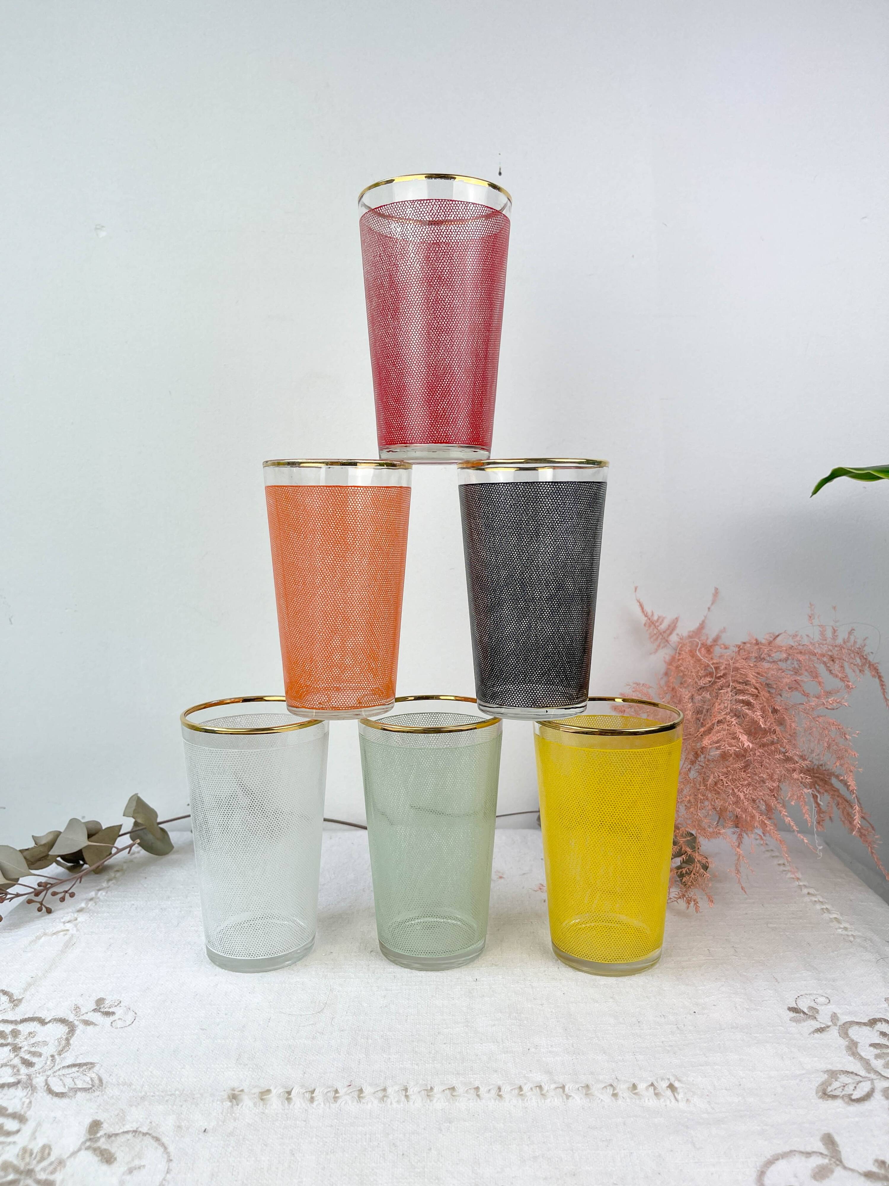 6 colorful juice glasses in their vintage basket