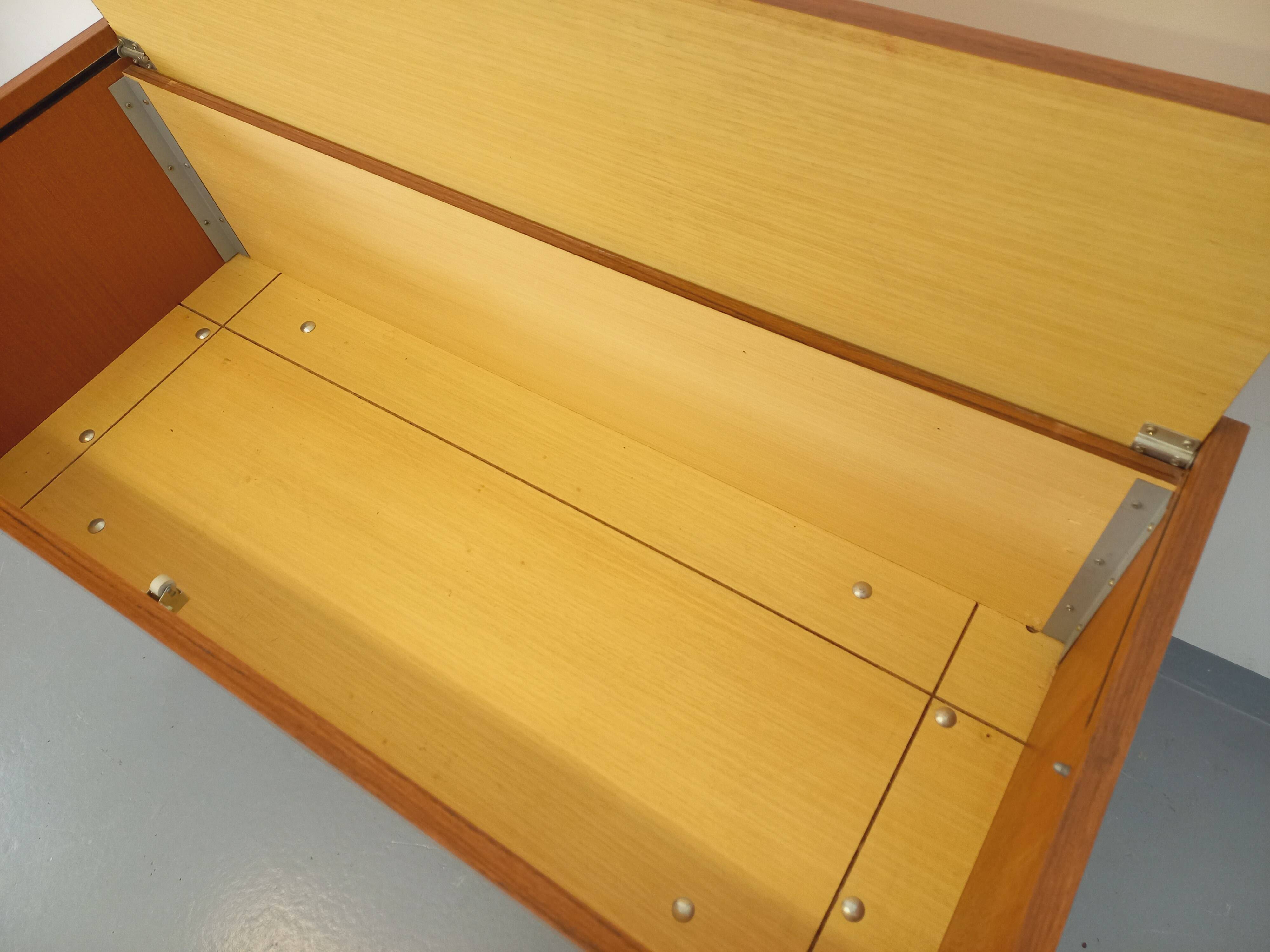 Vintage teak and black metal storage unit / chest on legs from the 70s