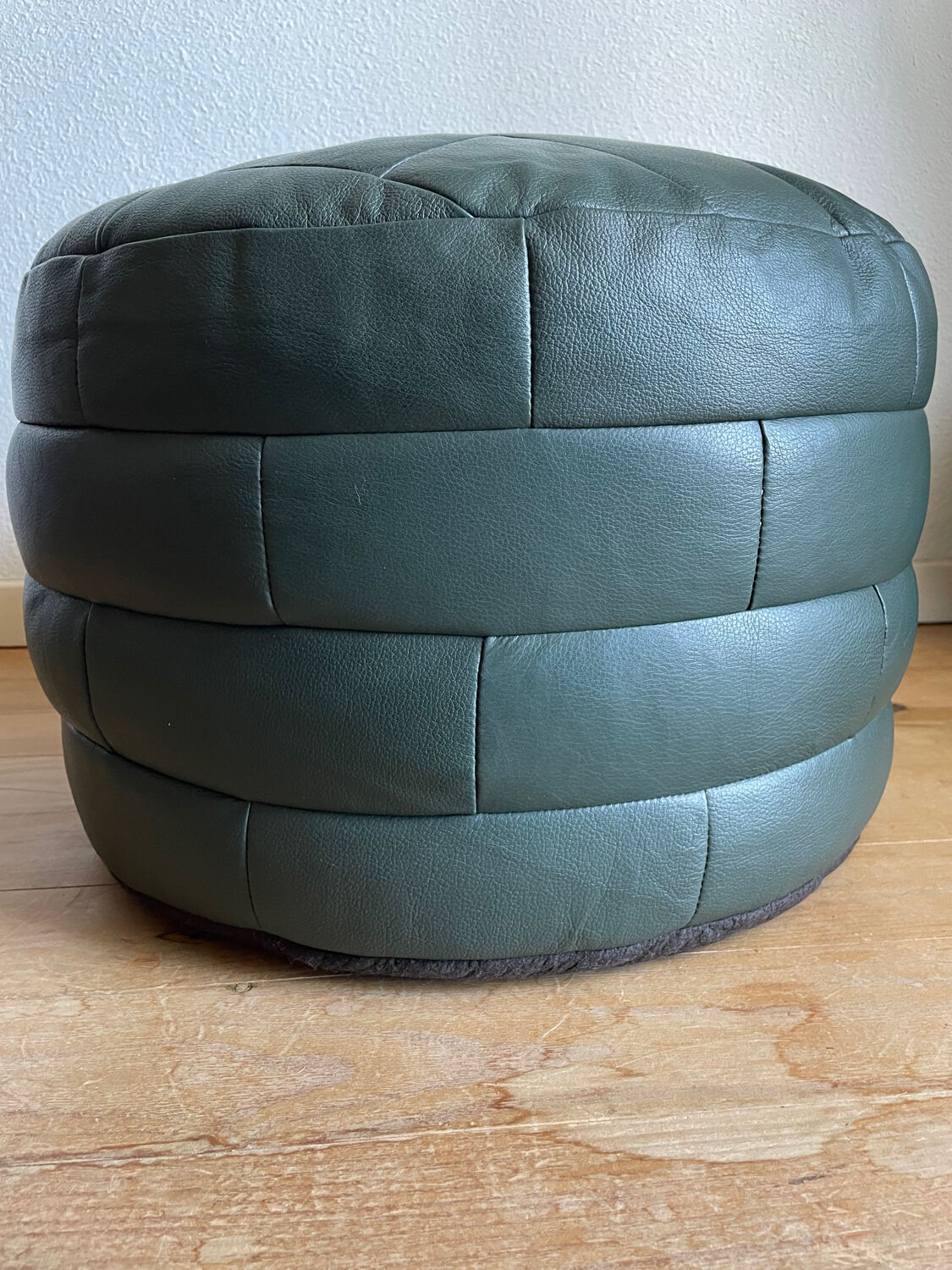 Green patchwork leather pouf from Sède