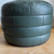 Green patchwork leather pouf from Sède