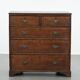 Antique English oak commode dating from the late 18th century.