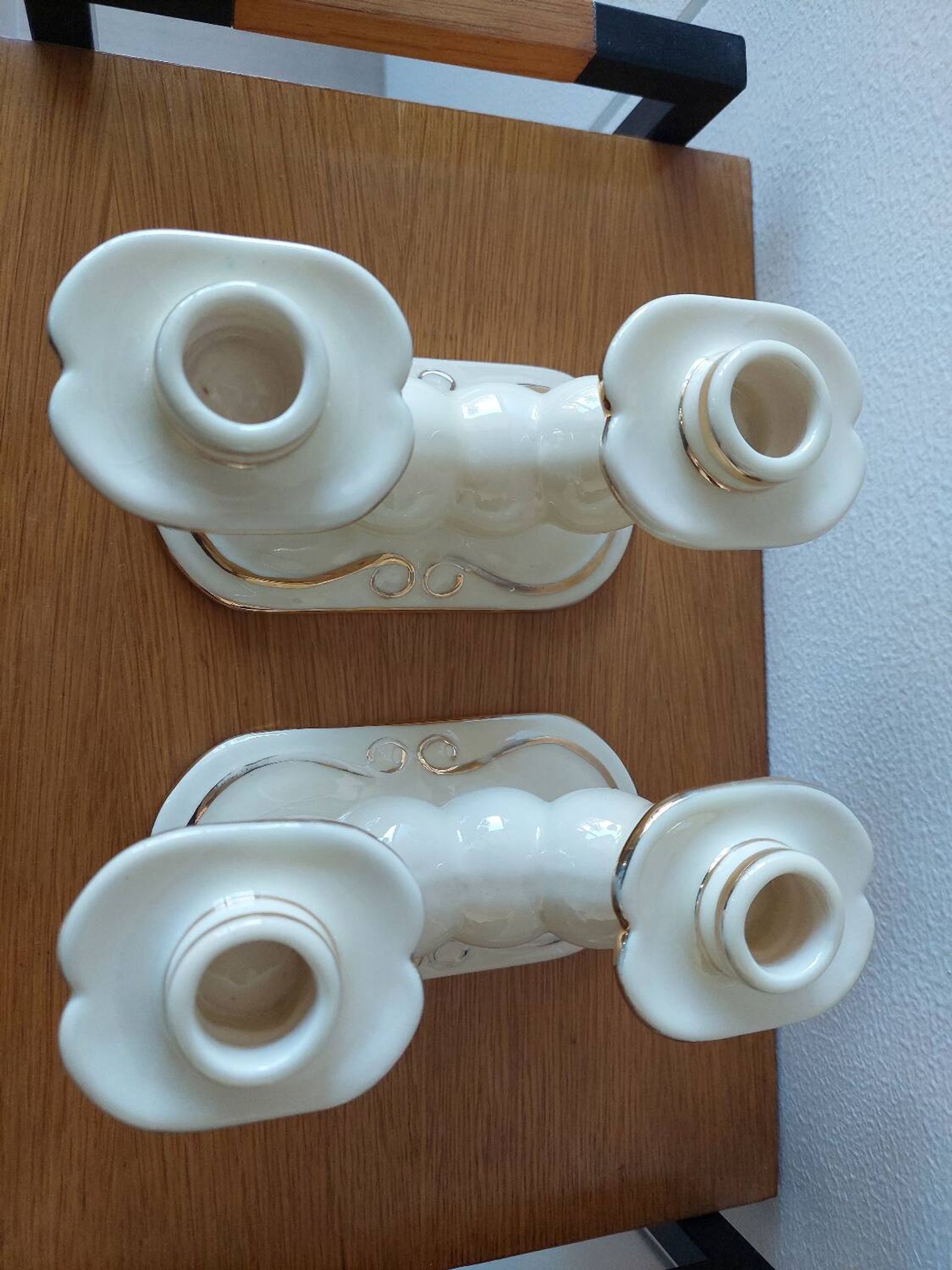 Pair of cream ceramic candlesticks with gold trim circa 1930-1950