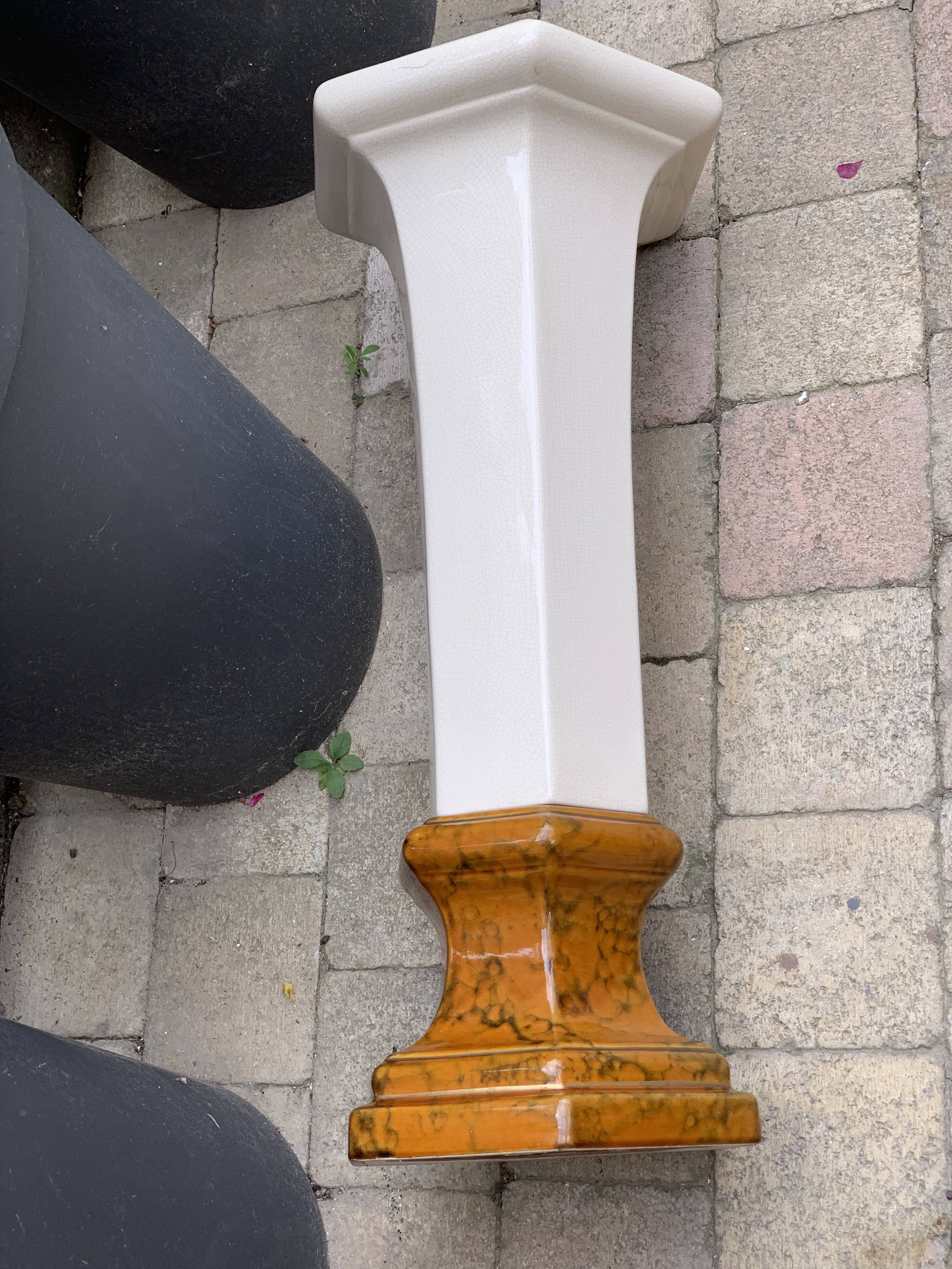 Column wears vintage plant