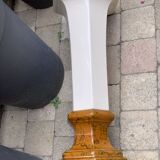 Column wears vintage plant