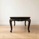 Antique Chinese coffee table in black and gold lacquered wood.