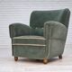 Fauteuil danois des années 1960, en laine de mobilier vert clair, avec des pieds en bois de chêne.