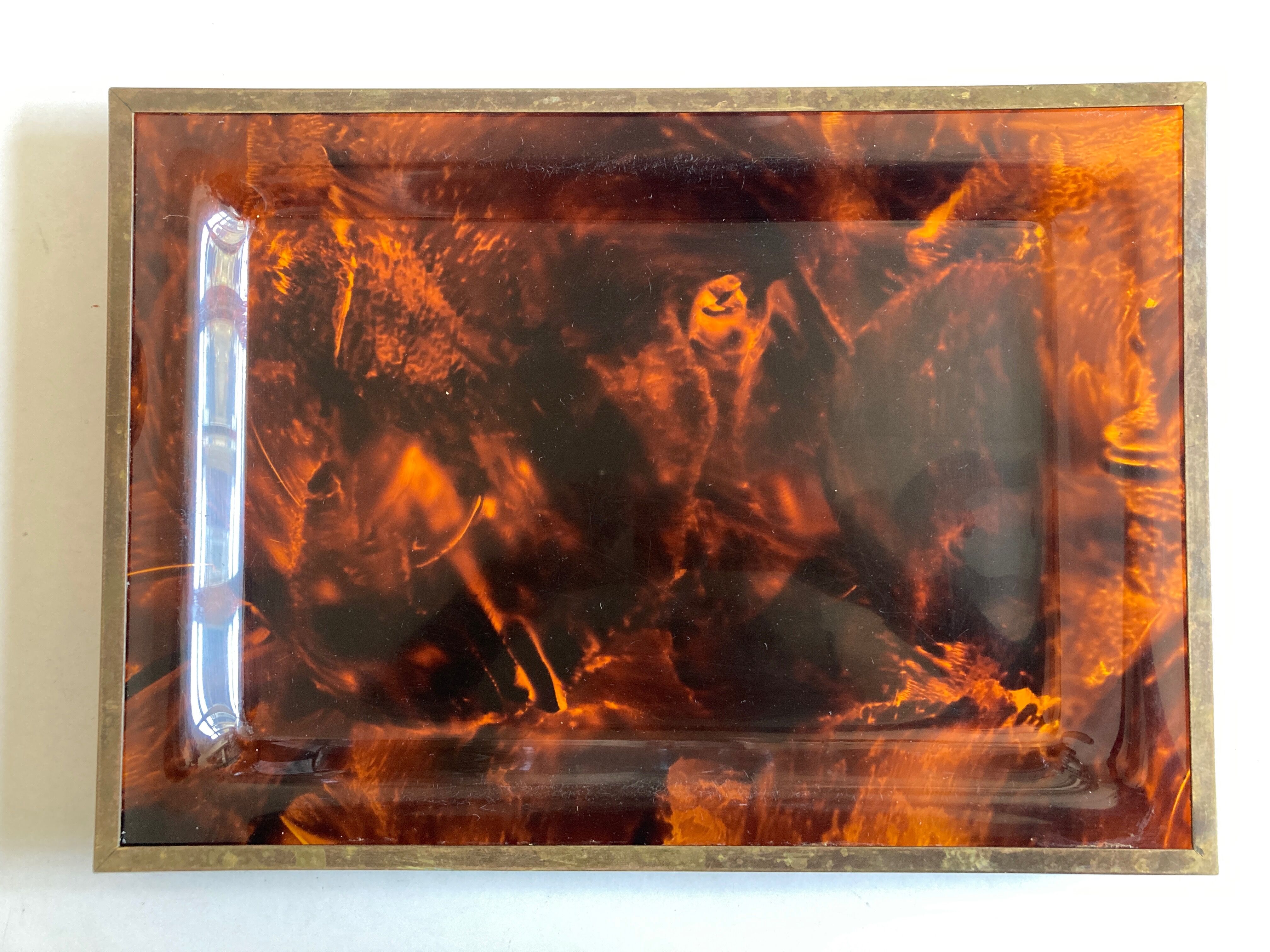 Plate of lucite scale and patinated brass