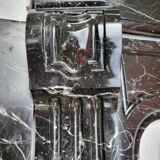 Pompadour fireplace with black marble modillions