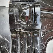 Pompadour fireplace with black marble modillions