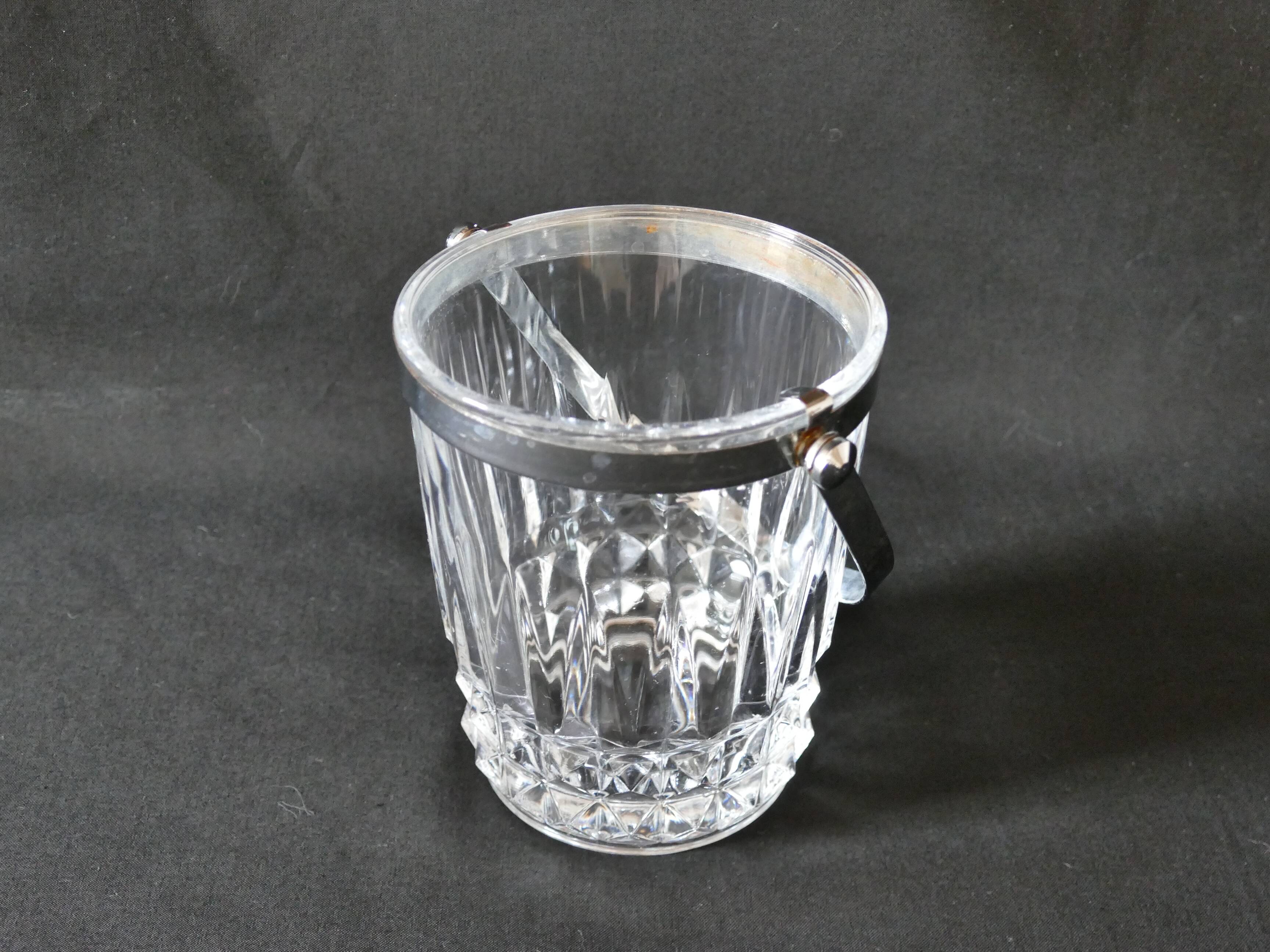 Vintage glass ice bucket stamped with a metal handle