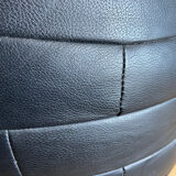 Black patchwork leather pouf from Sède