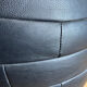 Pouf noir en cuir patchwork de Sède