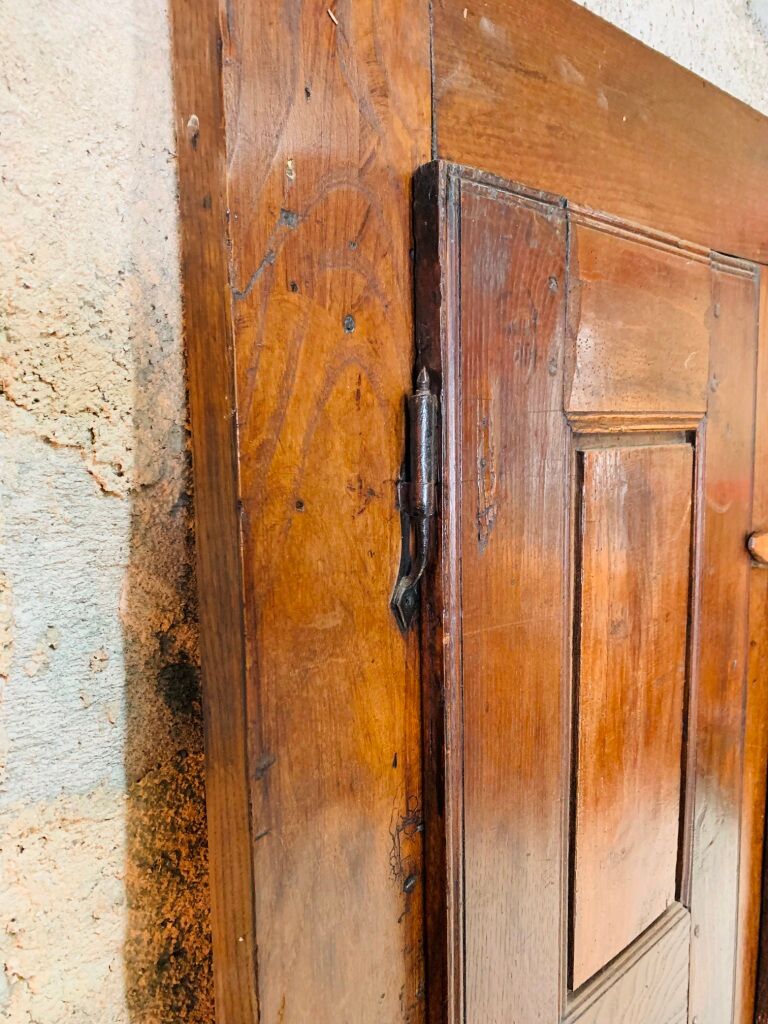Old wooden doors of a Savoyard wardrobe chalet mountain vintage