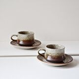 Cups and saucers in sandstone