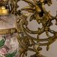 Antique lustre from the late 19th century, brass and opaline with floral decoration, 9 oil lights.