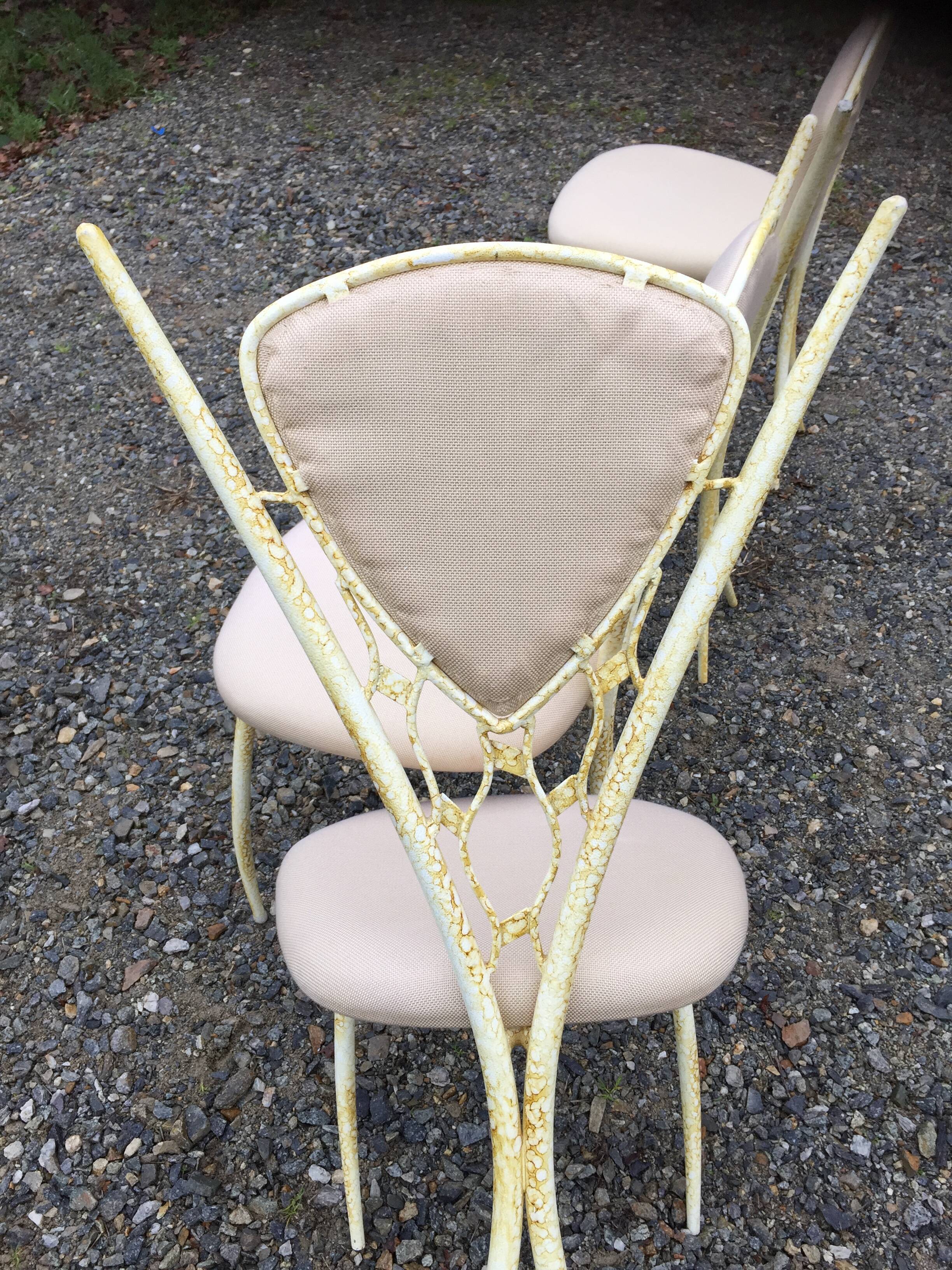 4 vintage chairs in tubular metal lacquered white yellow.