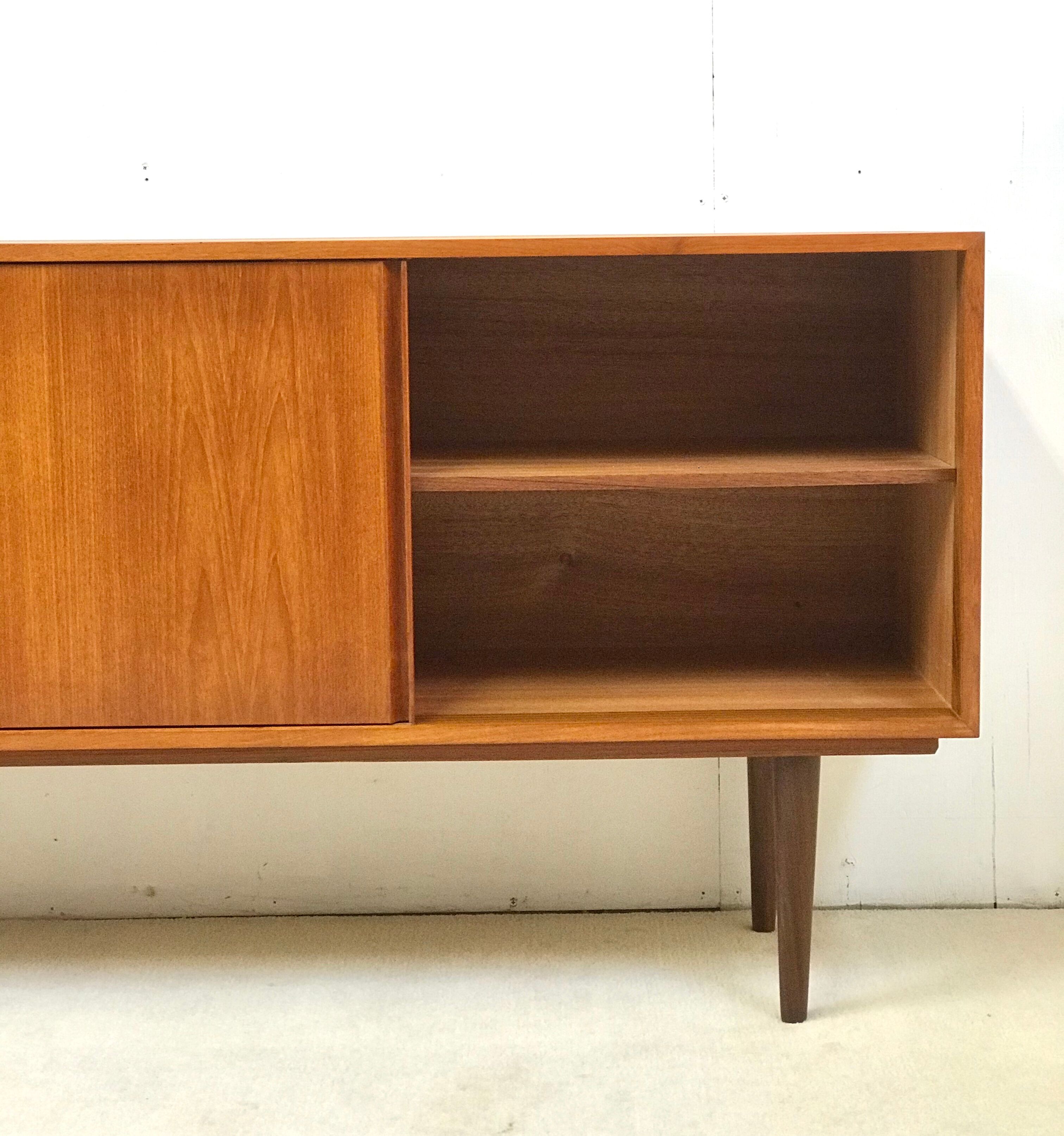 Danish teak sideboard with two sliding doors and 4 central drawers