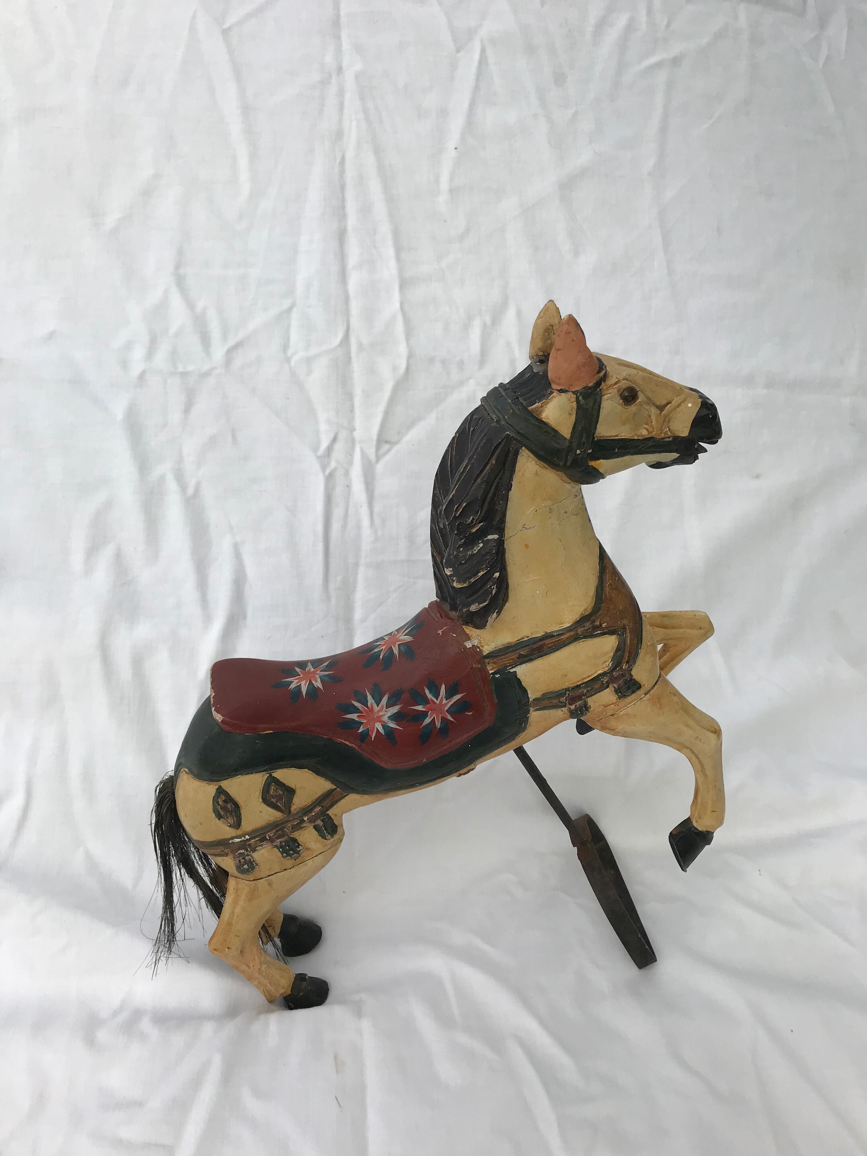 Wooden horse with period ironwork support