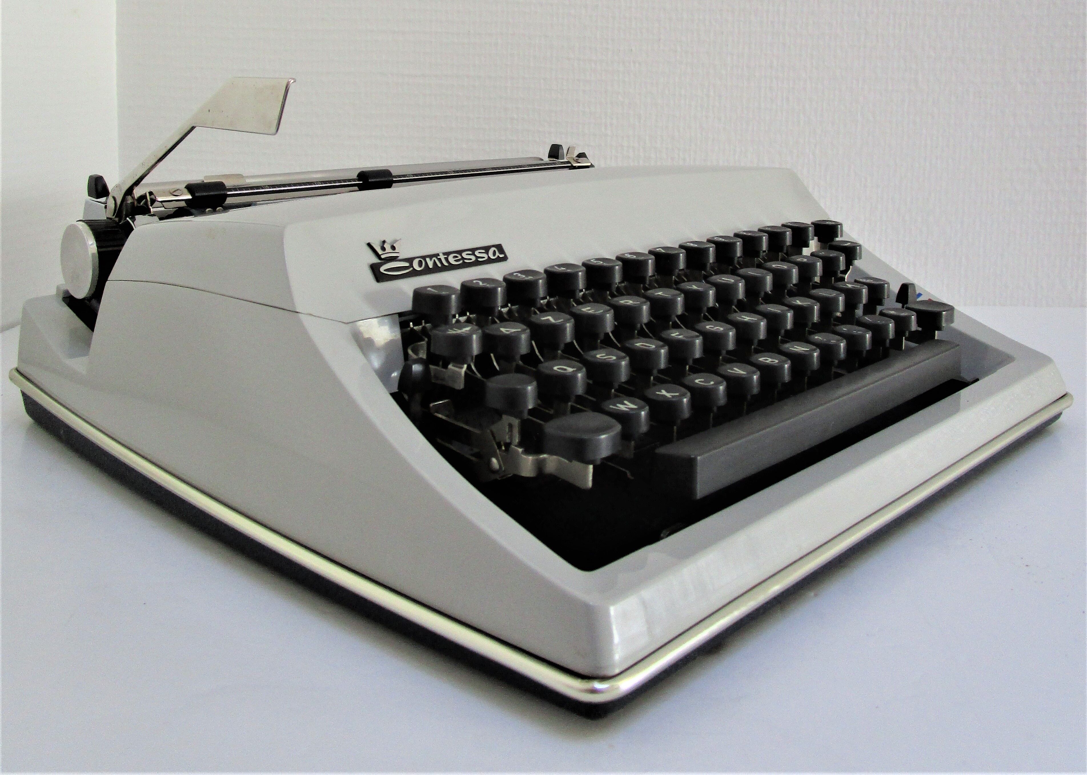 Writers' typewriters of light grey 70s Adler made in Holland