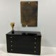 Black lacquered chest of drawers