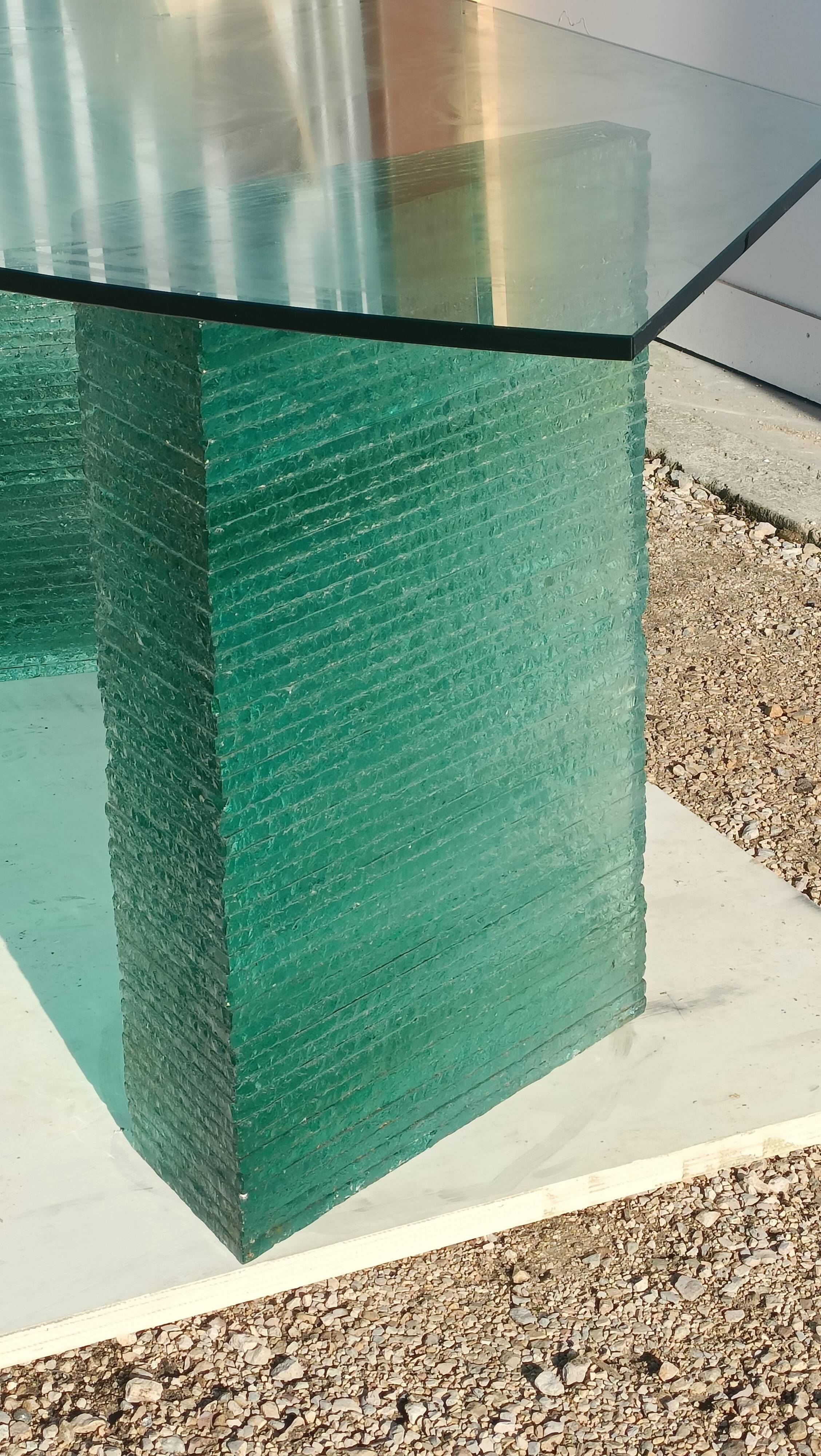 Solid glass desk with a half-moon top.