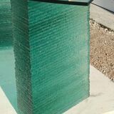 Solid glass desk with a half-moon top.