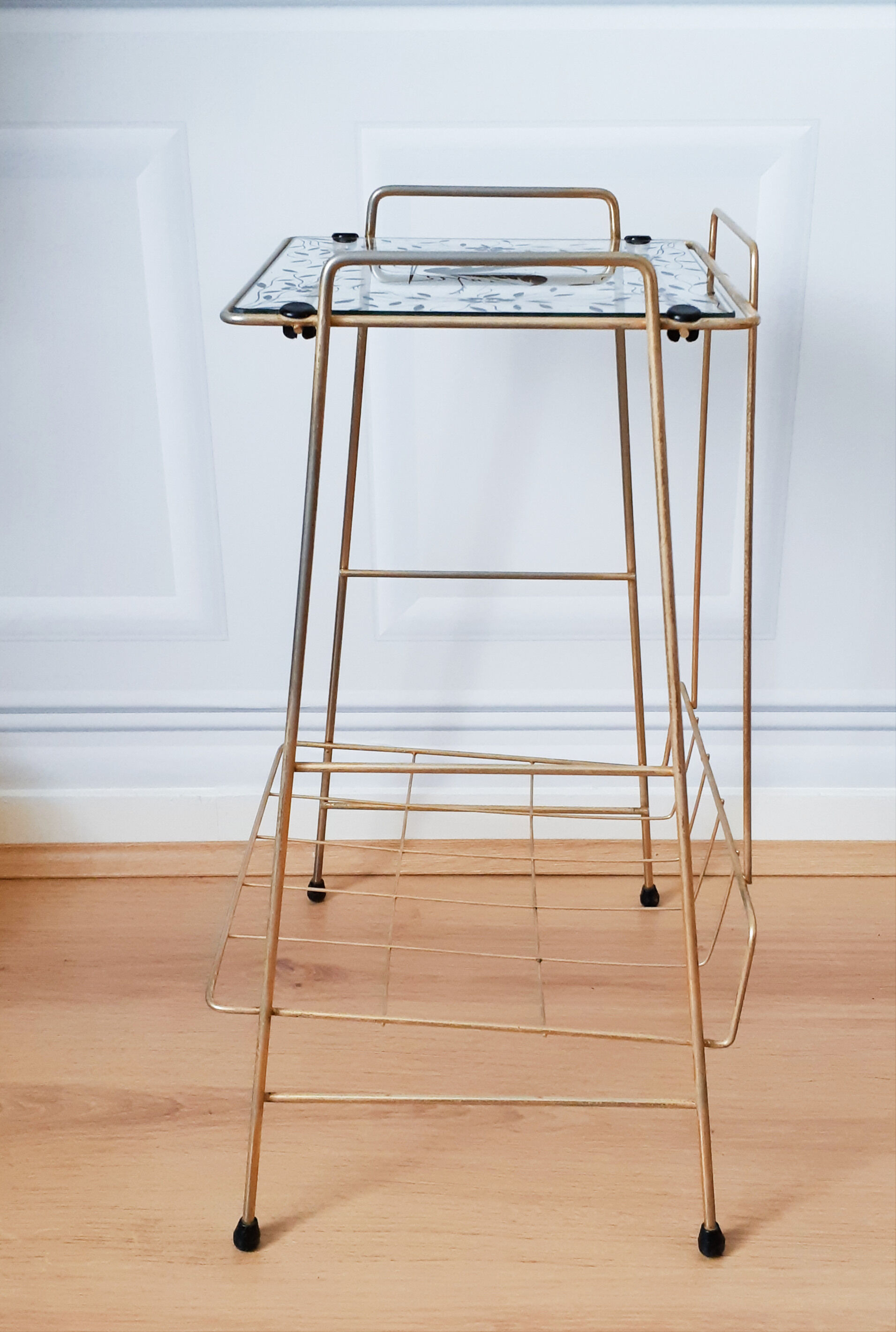Vintage metal and glass magazine rack