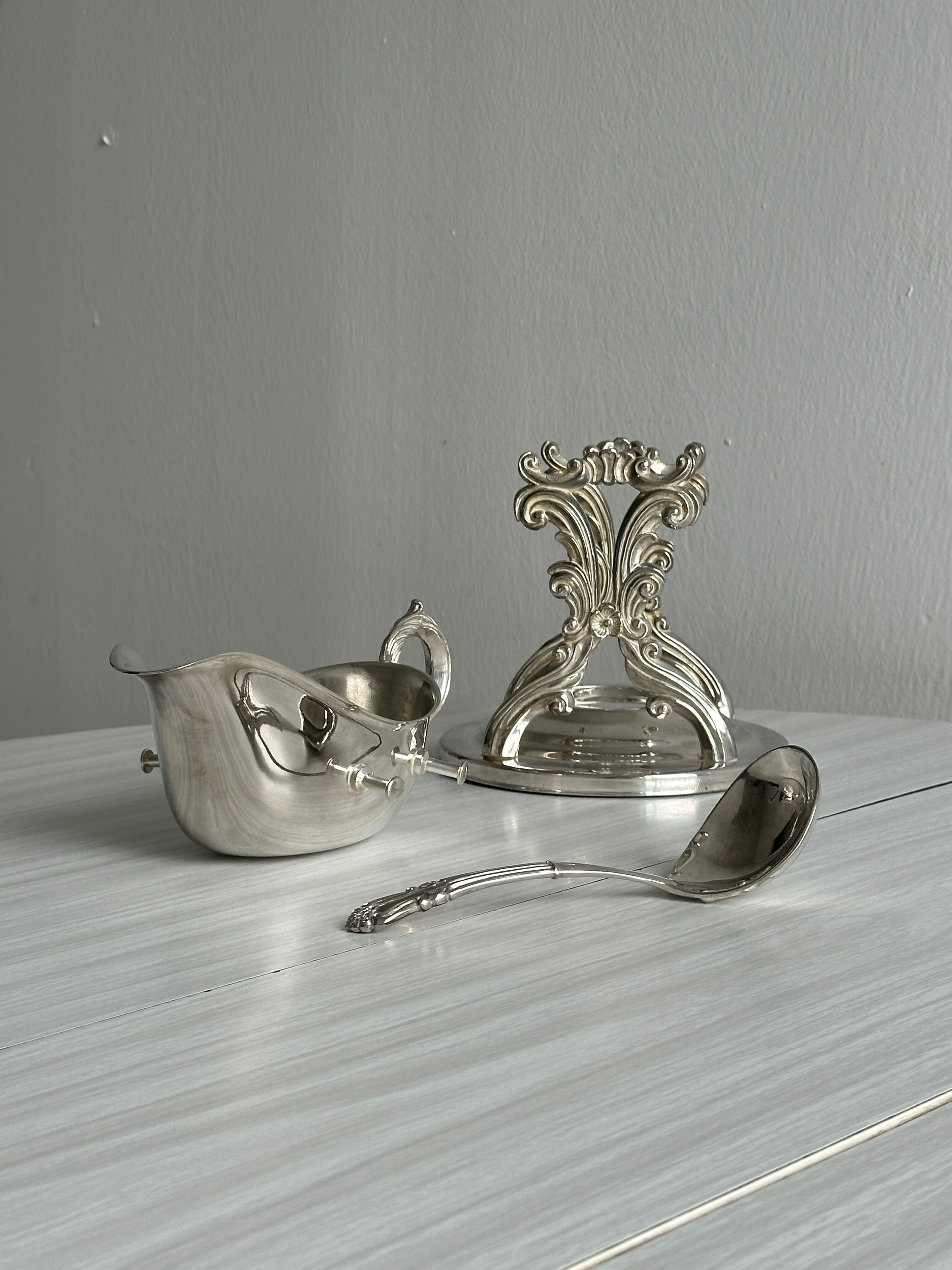 antique metal sauceboat with candle warmer and ladle