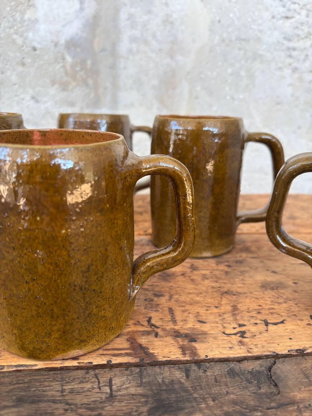 Set of 5 brown stoneware mugs