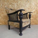 Old armchair upholstered in velvet, carved and caned wood