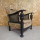 Old armchair upholstered in velvet, carved and caned wood