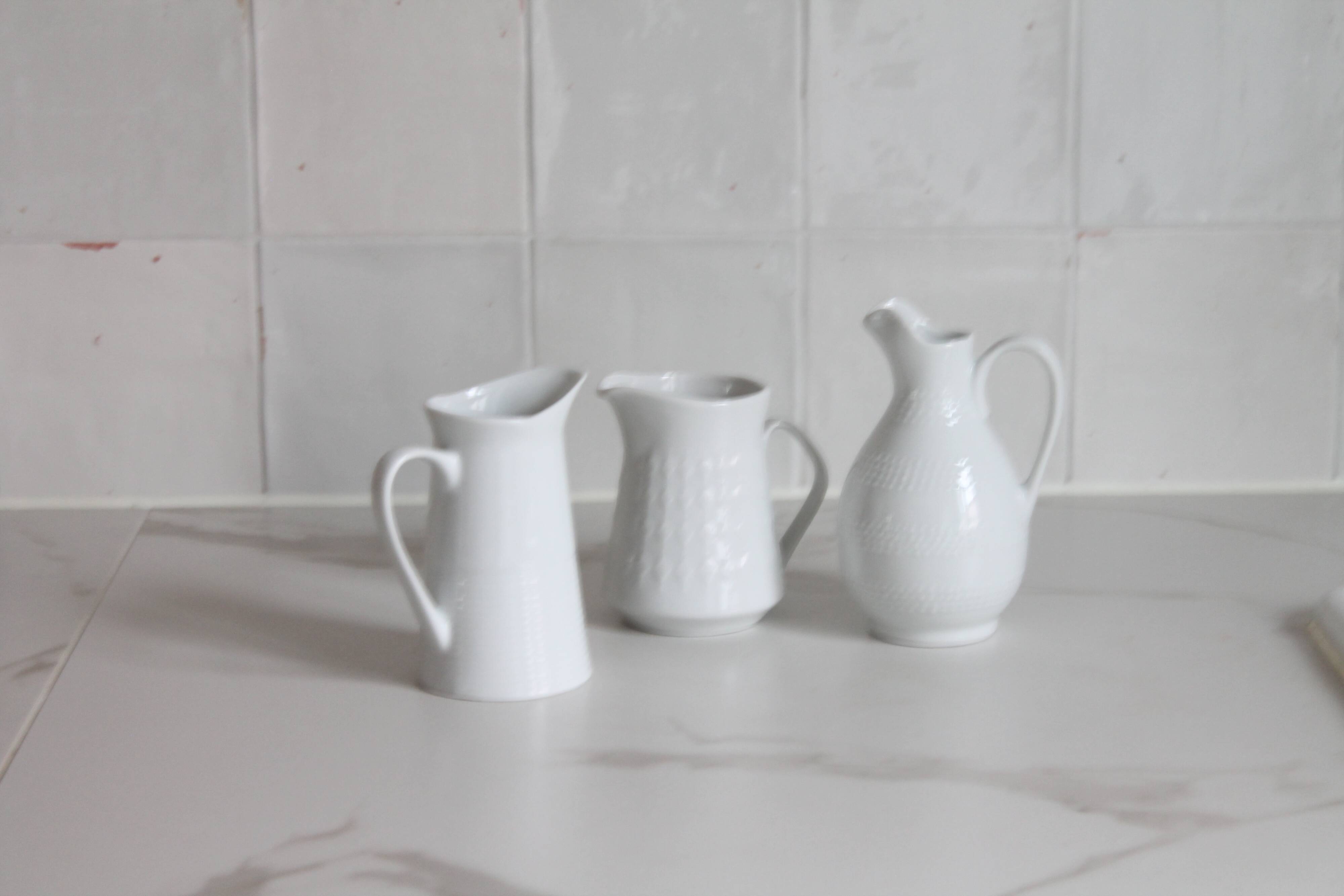 3 old French pitchers in white ceramic