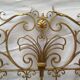 Golden wrought iron bedhead
