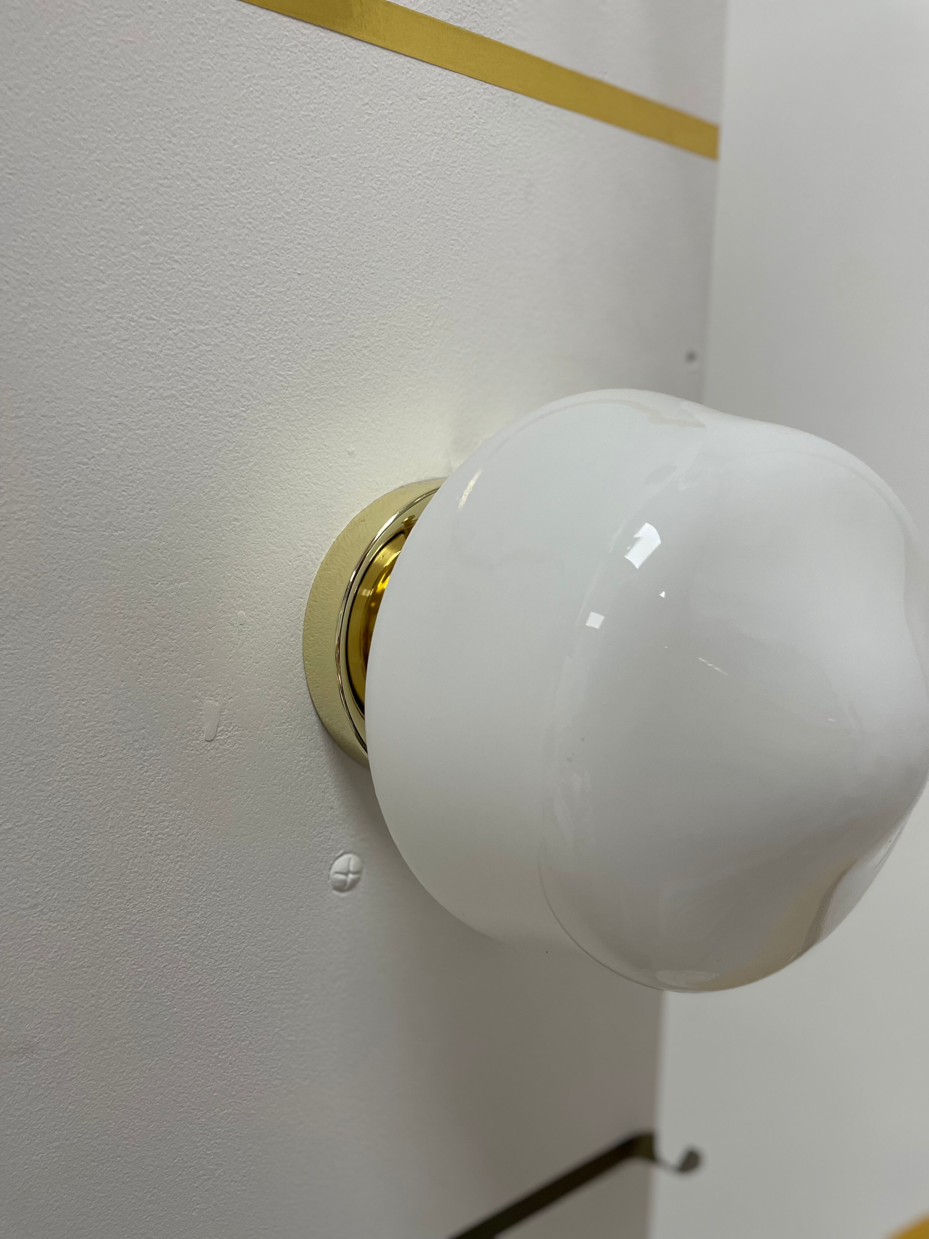 Opline and brass wall lamp