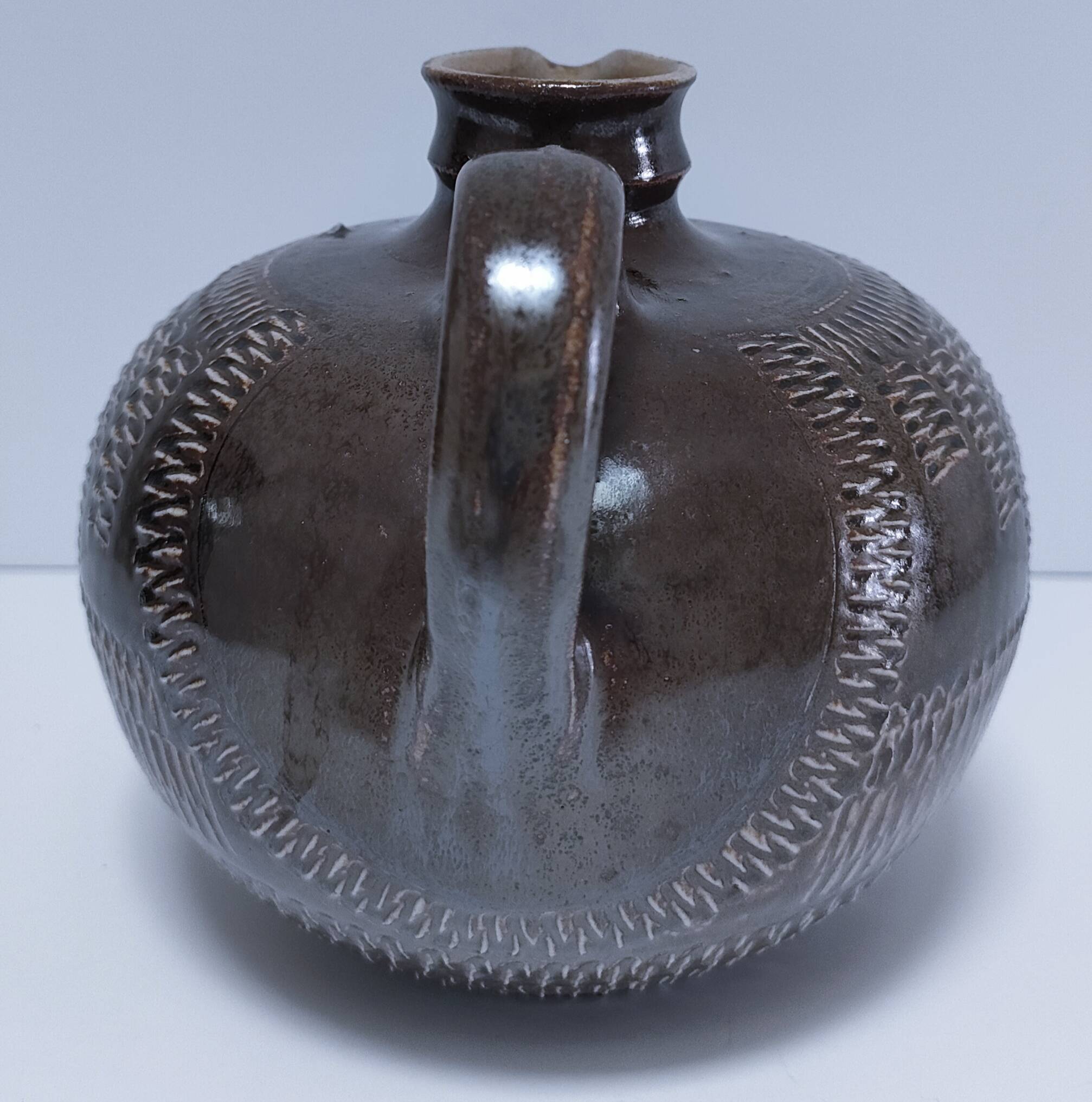 Vintage scarified glazed stoneware pitcher