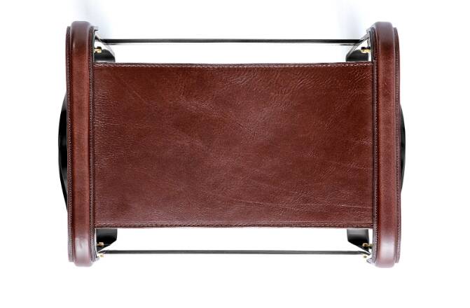 Smoky steel footrest in black and dark brown leather, contemporary style.