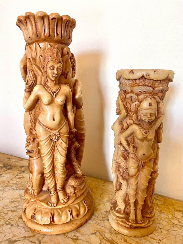 Two ancient Indonesian candlesticks.