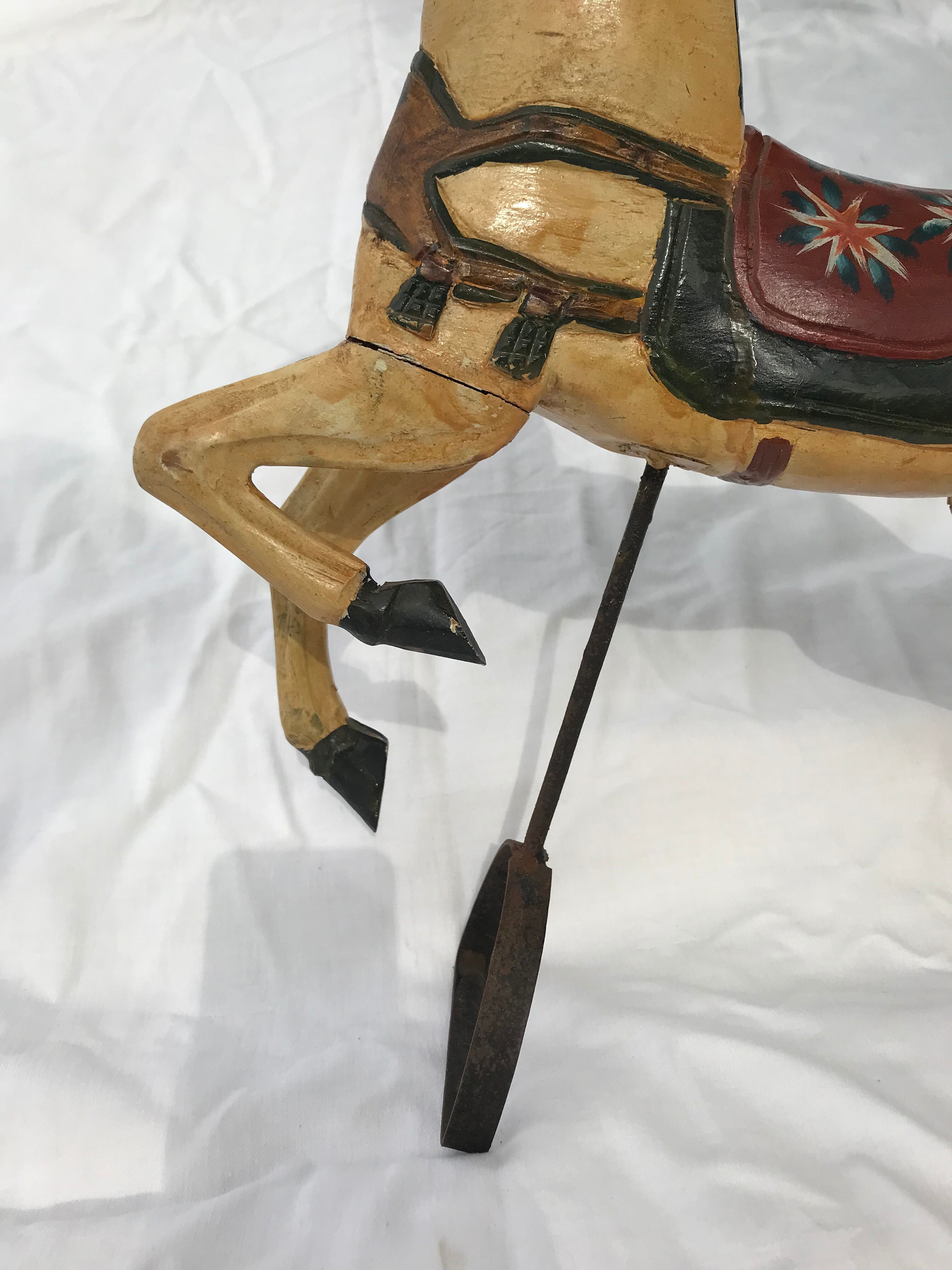 Wooden horse with period ironwork support