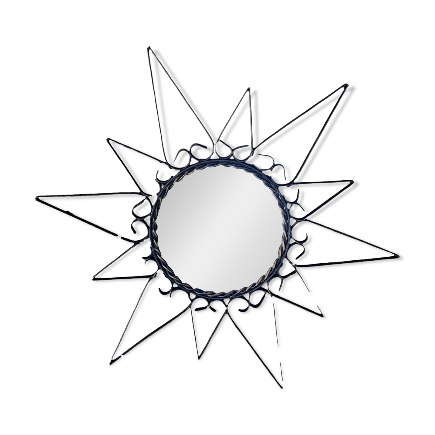 Old wrought metal sun mirror