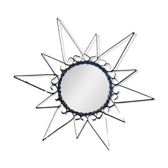 Old wrought metal sun mirror