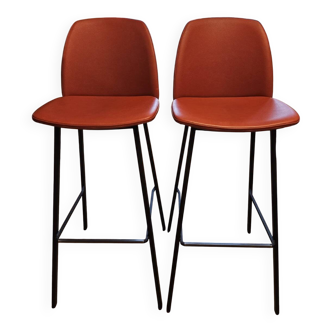 Two terracotta bar stools.