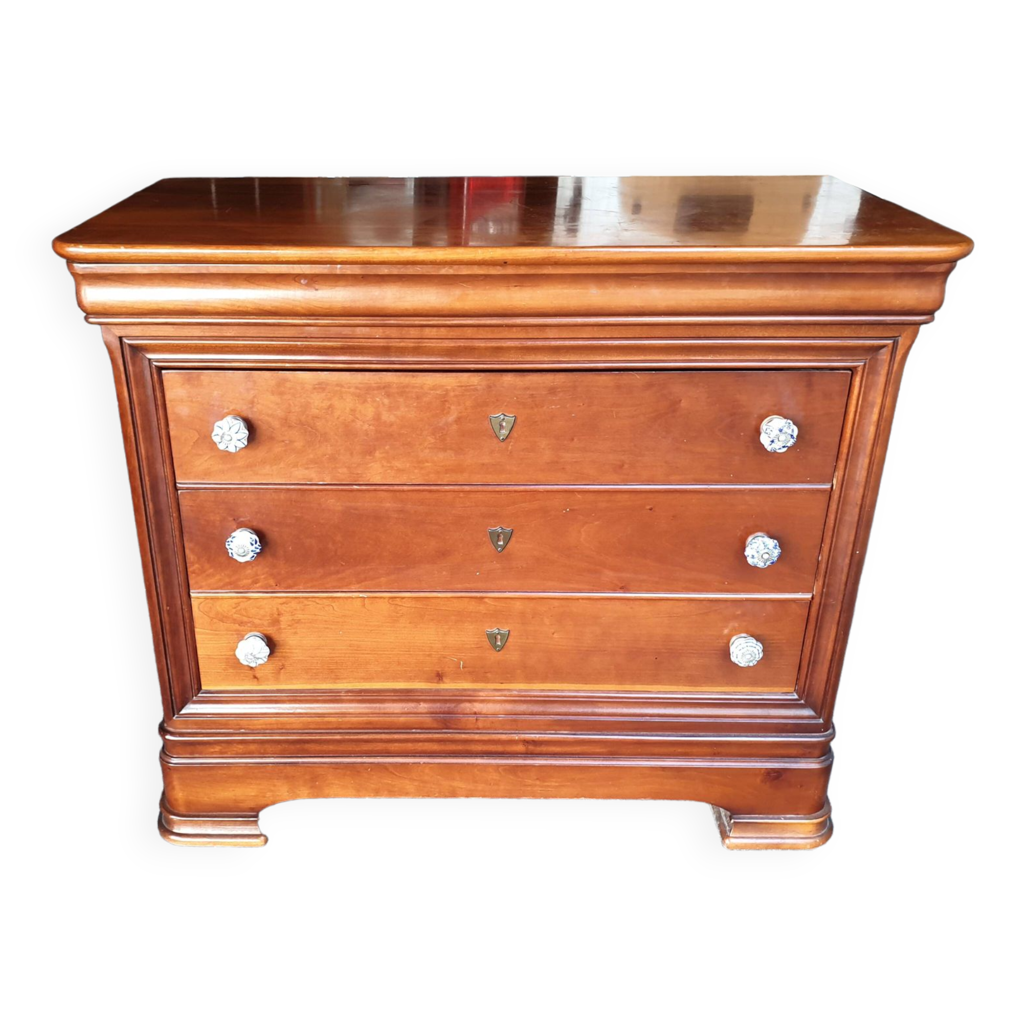 Commode louis Philippe à doucine 4 tiroirs merisier.
