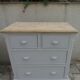 English commode of beautiful craftsmanship enhanced in pearl grey with a waxed finish.