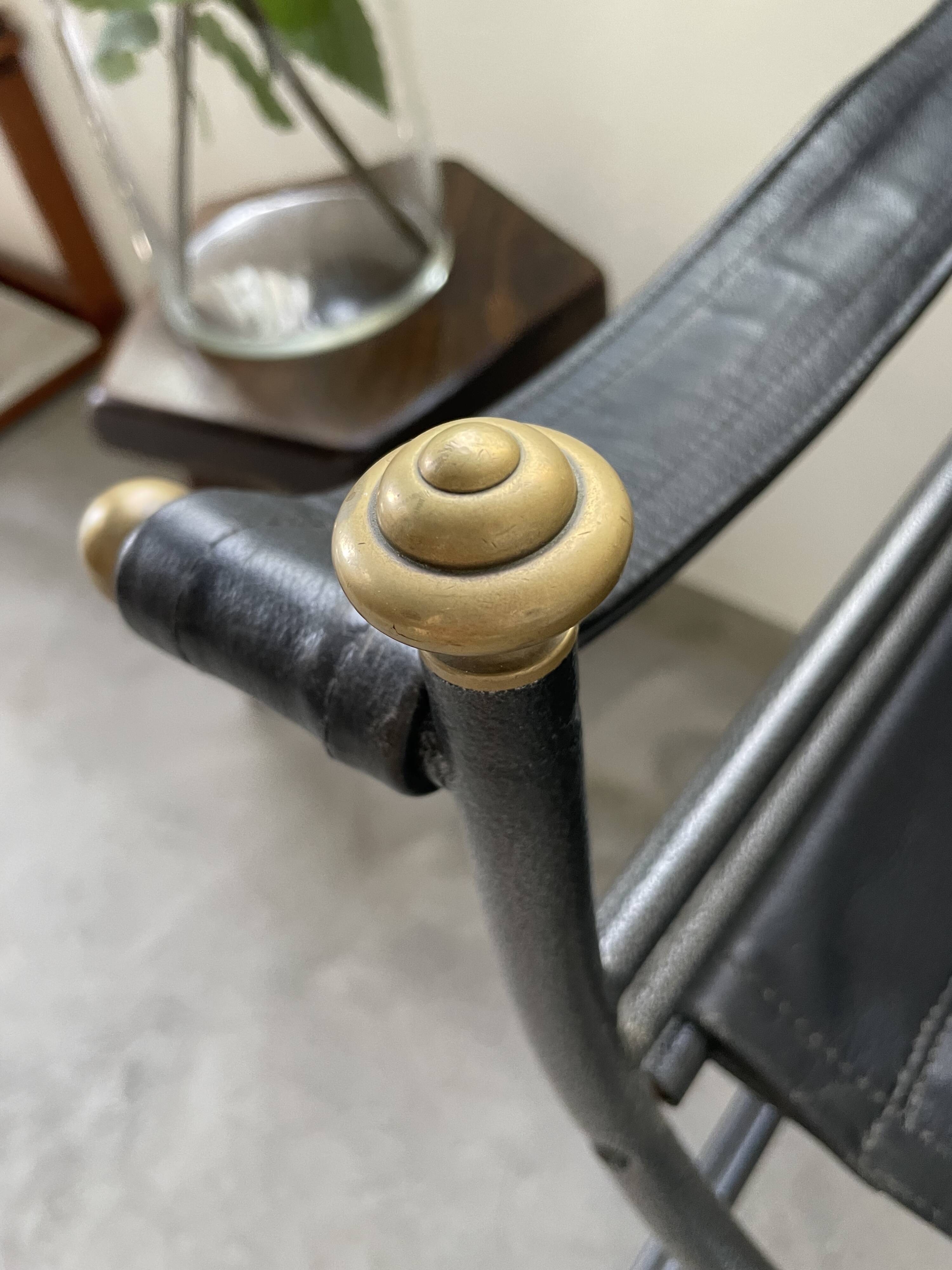 Pair of leather “curule” emperor armchairs