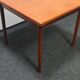 Petite table de salle à manger extensible en teck d'époque
