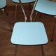 4 blue Formica chairs